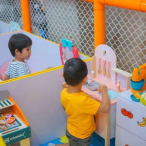 Two children in a play pen